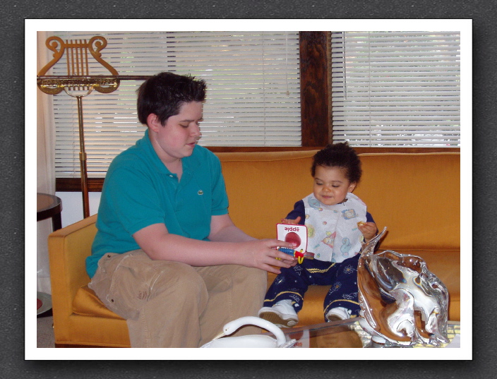 Ari and Kayla enjoy a book together