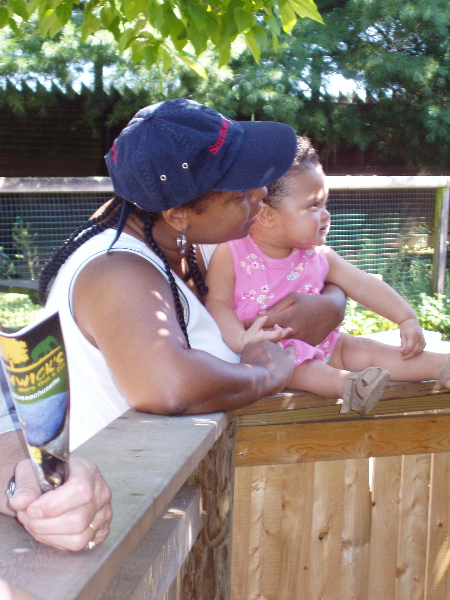 Mommy and Kayla look at the Parrot