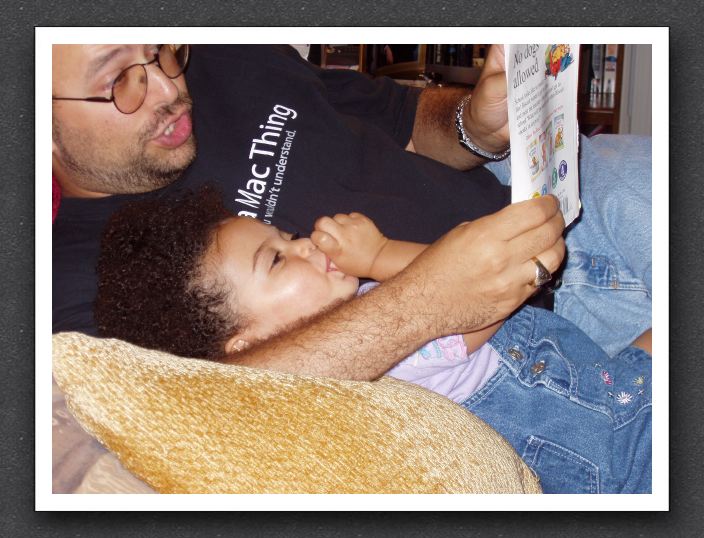 Daddy reads to Kayla