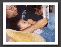 Daddy reads to Kayla