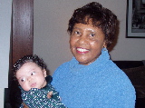 Grandma Holds Kayla in her Christmas Dress