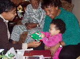 Kayla opens a Christmas gift