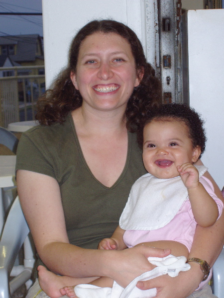 Aunt Jenn holds a smiley girl