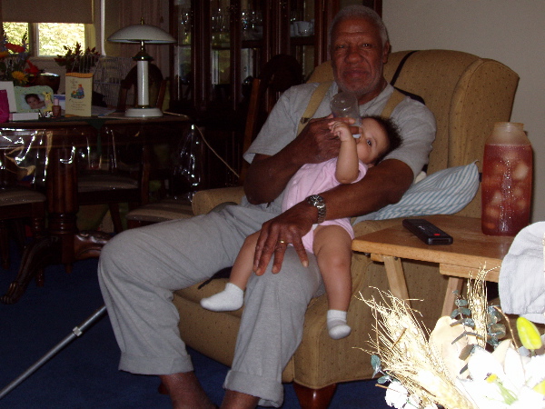 Grandpa Administers a Feeding