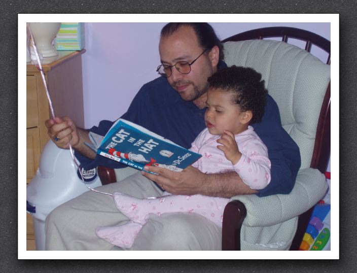 Daddy reads to Kayla