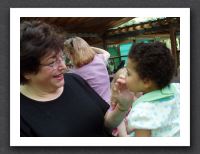 Nanna feeds Kayla at the Bronx Zoo