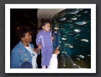 Grandma shows Kayla the shiny fish
