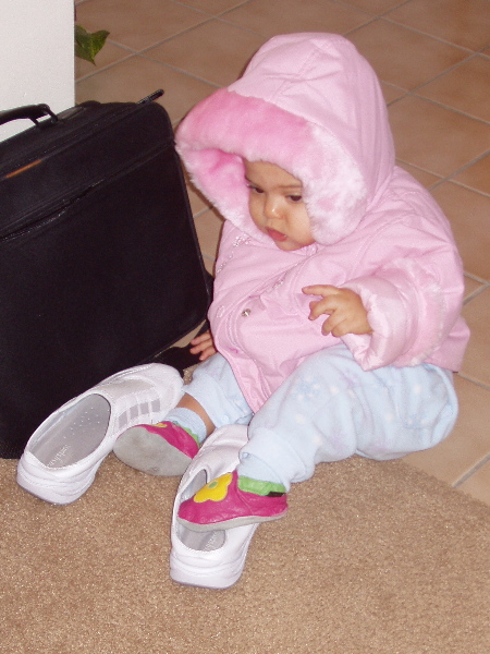 Kayla tries to fit into Mommy's shoes