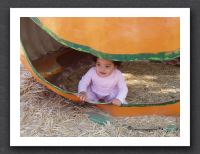 Little girl, big pumpkin