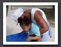 Mommy helps Kayla take a drink