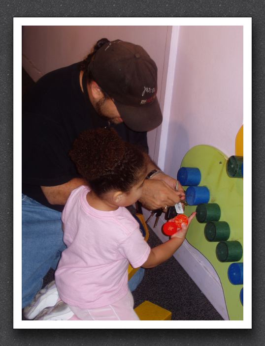 Kayla helps Daddy fix the exhibit