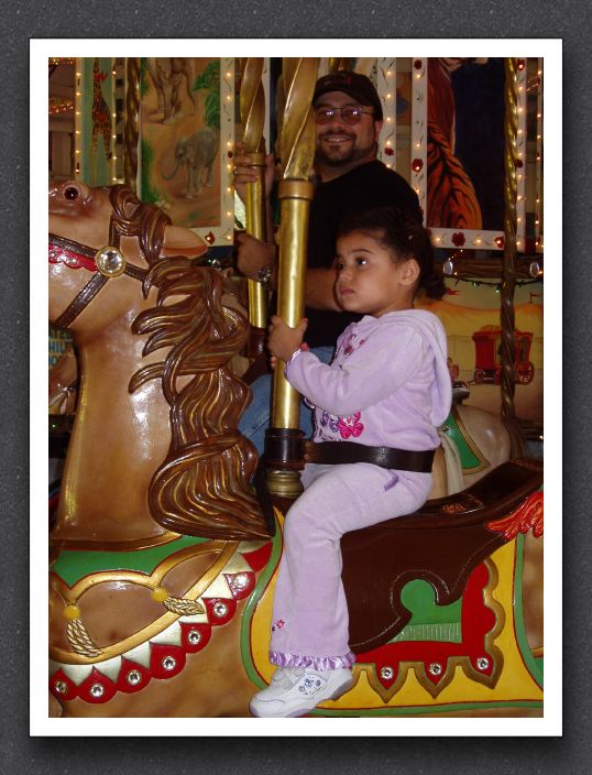 Daddy and Kayla on the carousel