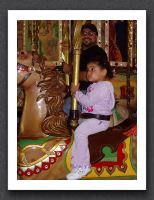 Daddy and Kayla on the carousel