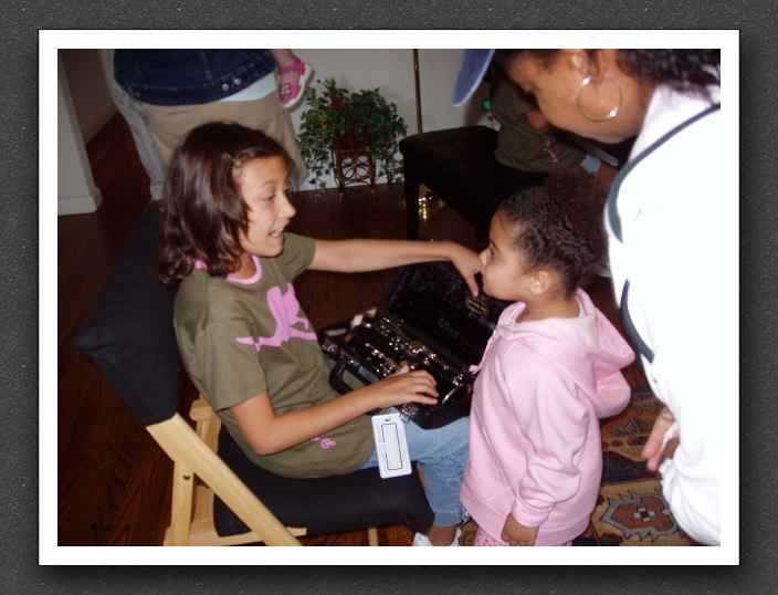 Gabby shows Kayla her new clarinet